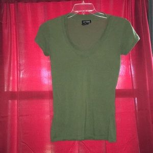 Green v-neck shirt.
